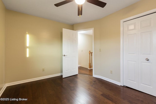 4316 Arwine Ct, Louisville, KY 40245 - unfurnished bedroom featuring a closet, baseboards, dark wood finished floors, and a ceiling fan