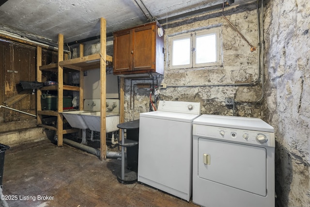 laundry area featuring a sink and washing machine and clothes dryer