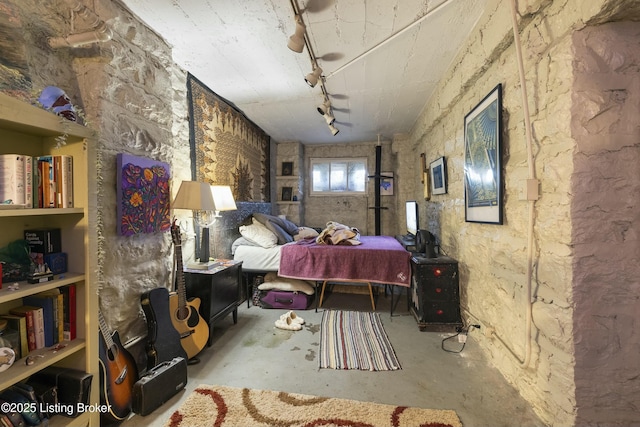 bedroom with unfinished concrete floors
