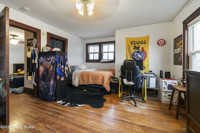 bedroom featuring ceiling fan and wood-type flooring