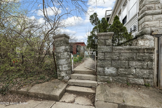 view of gate with fence