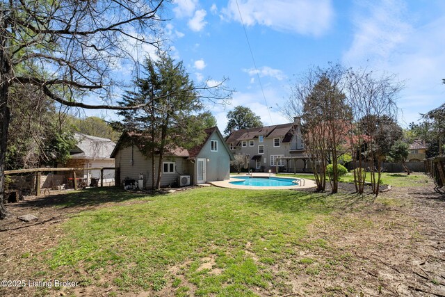 view of yard with a fenced in pool and a fenced backyard