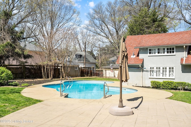 view of swimming pool with fence, a fenced in pool, and a patio