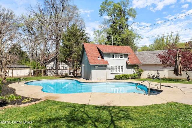view of swimming pool with a fenced in pool, a yard, a patio, and fence