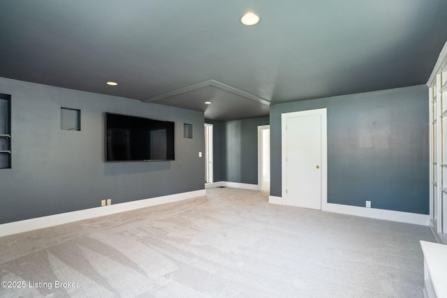 unfurnished room featuring light carpet, baseboards, and recessed lighting