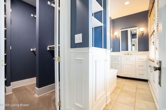 full bathroom with tile patterned floors and vanity