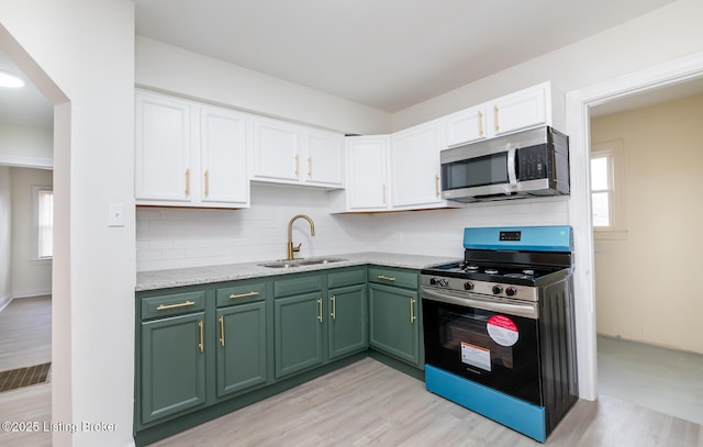 5512 Mae Ct, Louisville, KY 40214 - kitchen featuring a sink, stainless steel appliances, green cabinets, and white cabinetry