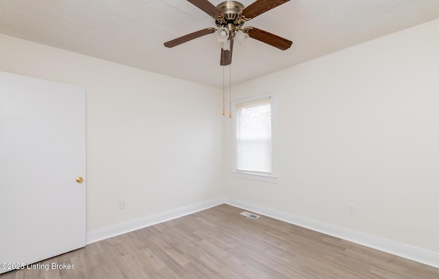 5512 Mae Ct, Louisville, KY 40214 - unfurnished room with light wood finished floors, visible vents, ceiling fan, baseboards, and a textured ceiling