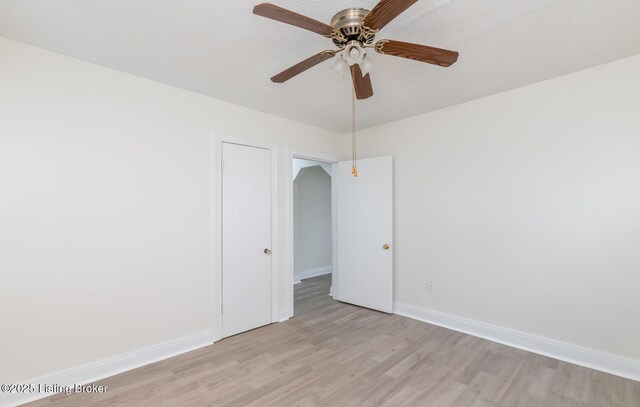 5512 Mae Ct, Louisville, KY 40214 - empty room featuring baseboards, a textured ceiling, ceiling fan, and light wood finished floors