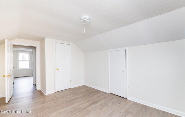 5512 Mae Ct, Louisville, KY 40214 - bonus room featuring light wood finished floors, lofted ceiling, and baseboards