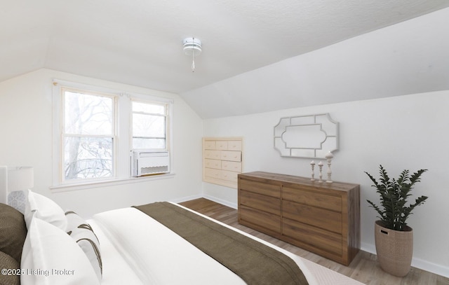 5512 Mae Ct, Louisville, KY 40214 - bedroom with vaulted ceiling, baseboards, and wood finished floors