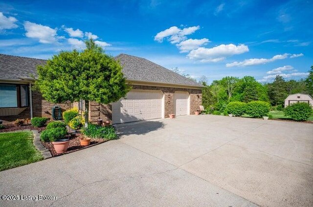 360 Rockcastle Villa, Shepherdsville, KY 40165 - view of front facade featuring concrete driveway and a garage