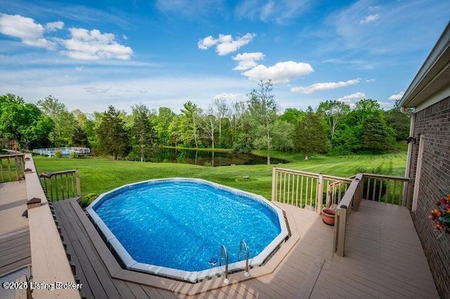360 Rockcastle Villa, Shepherdsville, KY 40165 - view of swimming pool featuring a deck, a yard, and a forest view