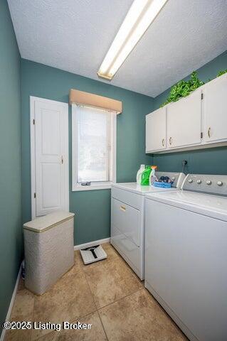 360 Rockcastle Villa, Shepherdsville, KY 40165 - washroom featuring washing machine and dryer, cabinet space, baseboards, and light tile patterned floors