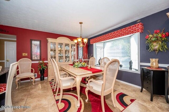 360 Rockcastle Villa, Shepherdsville, KY 40165 - dining space with a chandelier, tile patterned floors, and baseboards