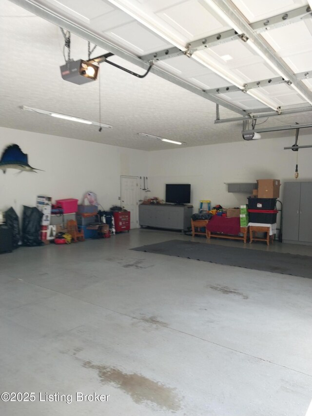 360 Rockcastle Villa, Shepherdsville, KY 40165 - garage featuring a garage door opener