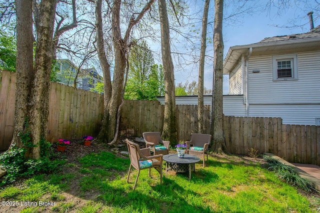 view of yard featuring a fenced backyard
