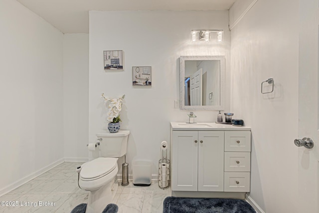 7603 Cottage Cove Way, Louisville, KY 40214 - bathroom featuring vanity, toilet, baseboards, and marble finish floor