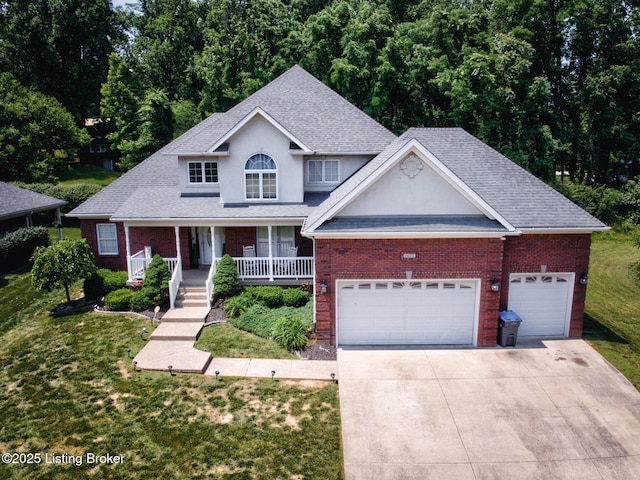 7603 Cottage Cove Way, Louisville, KY 40214 - traditional-style home featuring concrete driveway, brick siding, a front lawn, roof with shingles, and stucco siding