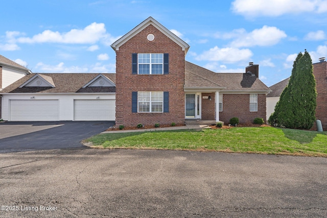 1501 Eagle Nest Way, Lyndon, KY 40222 - traditional-style house with driveway, an attached garage, brick siding, a front lawn, and a chimney