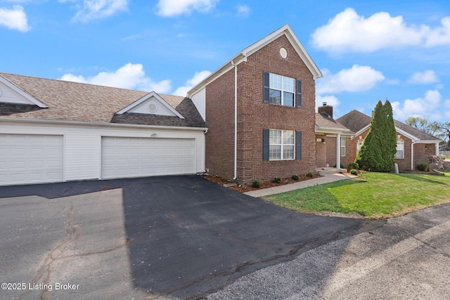 1501 Eagle Nest Way, Lyndon, KY 40222 - traditional home featuring brick siding, driveway, a front lawn, and a garage
