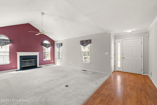 1501 Eagle Nest Way, Lyndon, KY 40222 - unfurnished living room featuring ceiling fan, a fireplace with flush hearth, baseboards, wood finished floors, and crown molding