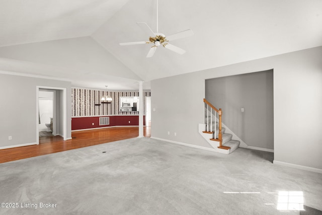1501 Eagle Nest Way, Lyndon, KY 40222 - unfurnished living room featuring carpet flooring, ceiling fan, baseboards, high vaulted ceiling, and stairway