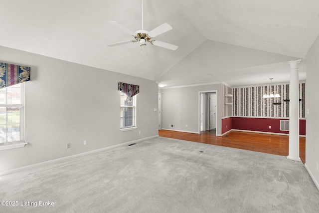 1501 Eagle Nest Way, Lyndon, KY 40222 - unfurnished living room featuring carpet flooring, a chandelier, baseboards, a ceiling fan, and vaulted ceiling