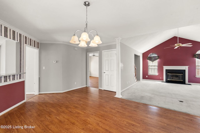 1501 Eagle Nest Way, Lyndon, KY 40222 - unfurnished living room with a ceiling fan, a glass covered fireplace, baseboards, lofted ceiling, and crown molding