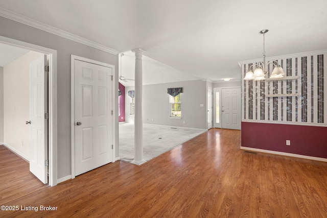 1501 Eagle Nest Way, Lyndon, KY 40222 - spare room featuring a chandelier, baseboards, wood finished floors, and ornamental molding