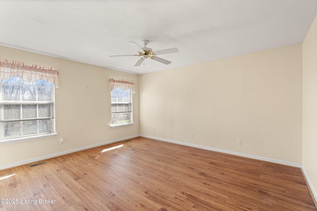 1501 Eagle Nest Way, Lyndon, KY 40222 - unfurnished room with light wood-style floors, baseboards, and a ceiling fan
