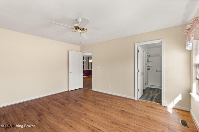1501 Eagle Nest Way, Lyndon, KY 40222 - empty room with light wood-style floors, a ceiling fan, and baseboards