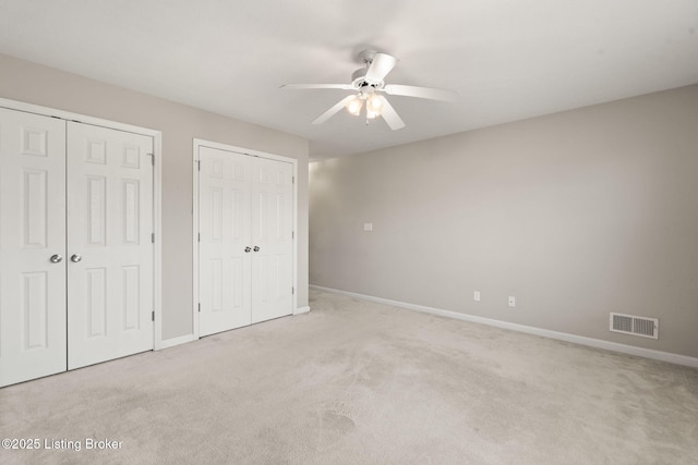 1501 Eagle Nest Way, Lyndon, KY 40222 - unfurnished bedroom with two closets, carpet floors, and baseboards