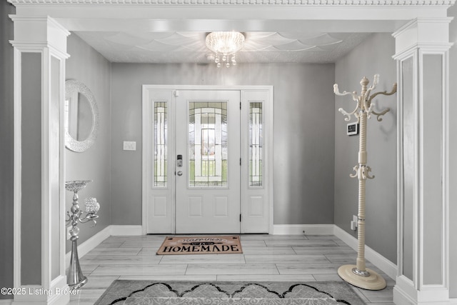 6301 Southside Dr, Louisville, KY 40214 - foyer featuring baseboards, an inviting chandelier, and wood tiled floor