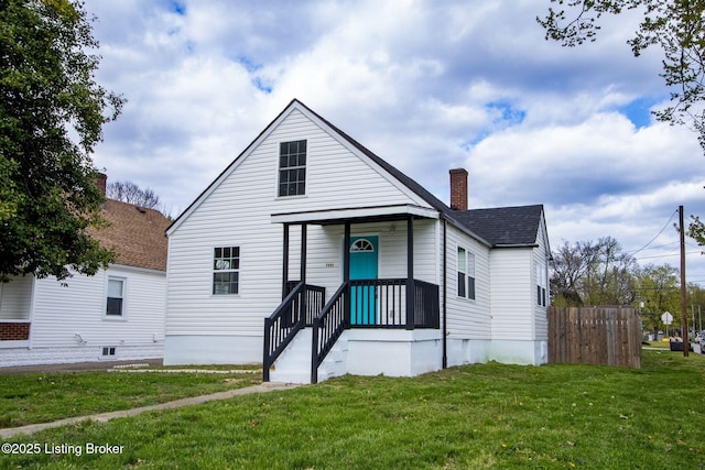 1301 Central Ave, Louisville, KY 40215 - bungalow with a front yard, a chimney, fence, and a shingled roof