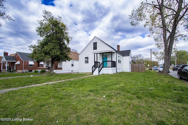 1301 Central Ave, Louisville, KY 40215 - bungalow featuring a chimney and a front lawn