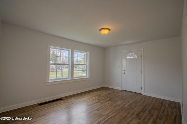 1301 Central Ave, Louisville, KY 40215 - foyer entrance with wood finished floors, baseboards, and visible vents