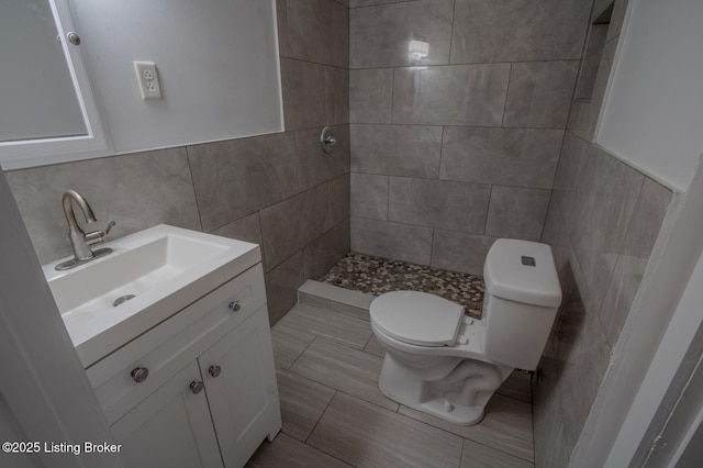 1301 Central Ave, Louisville, KY 40215 - full bath featuring toilet, tile walls, a tile shower, and vanity