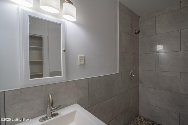 1301 Central Ave, Louisville, KY 40215 - full bath with a sink, a tile shower, and decorative backsplash
