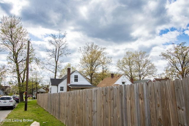 1301 Central Ave, Louisville, KY 40215 - view of side of home with a yard and fence