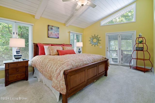bedroom with lofted ceiling with beams, access to outside, multiple windows, and light carpet