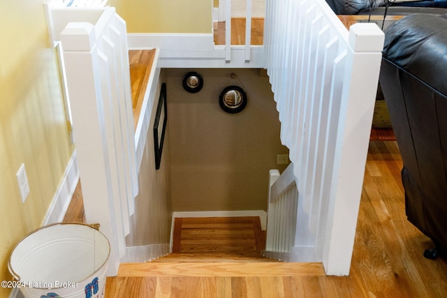 stairs with wood finished floors