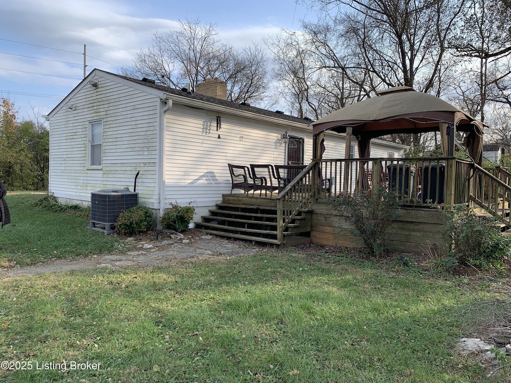 3616 Breckenridge Ln, Louisville, KY 40218 - back of house featuring a wooden deck, a chimney, a gazebo, a garage, and central air condition unit