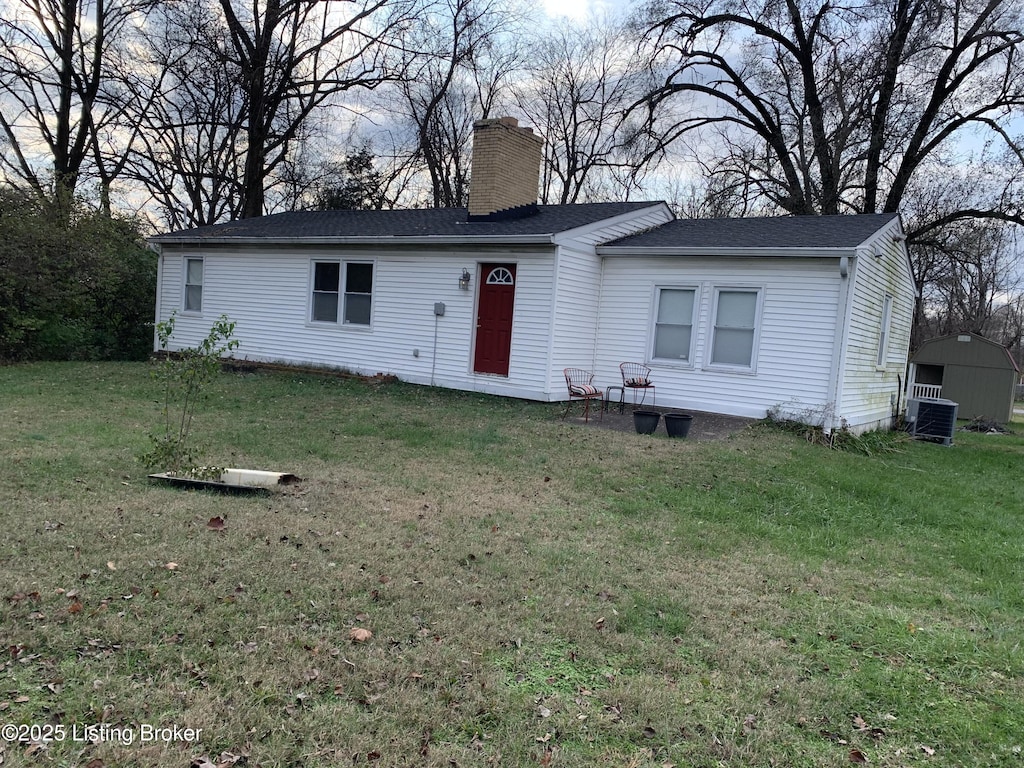 3616 Breckenridge Ln, Louisville, KY 40218 - ranch-style house featuring central AC, a chimney, a front yard, and a shingled roof
