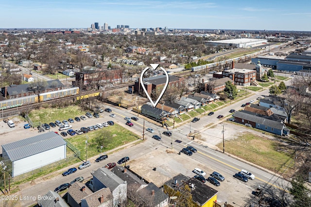 birds eye view of property featuring a city view