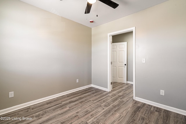unfurnished bedroom with baseboards, wood finished floors, and a ceiling fan