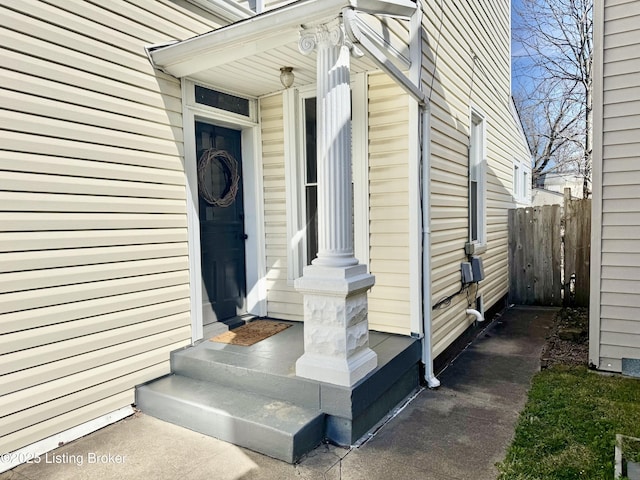 doorway to property with fence