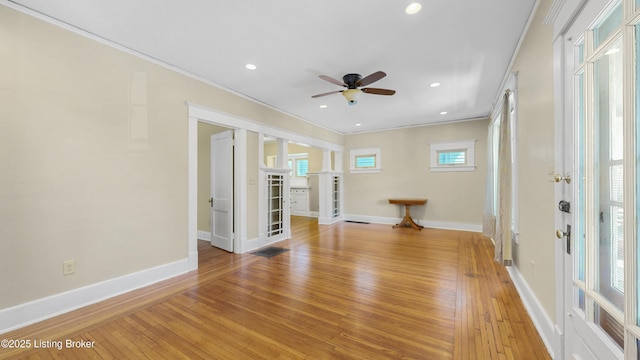 empty room featuring a ceiling fan, light wood-type flooring, french doors, and baseboards