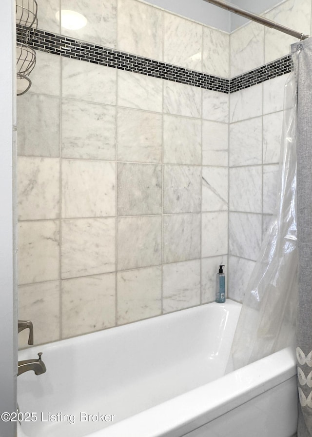 full bath featuring shower / tub combo with curtain