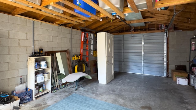 garage featuring concrete block wall